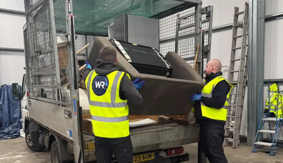 Uniformed team loading waste into van in the North West