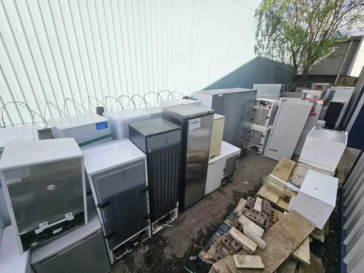 Uniformed team loading waste into van in the North West