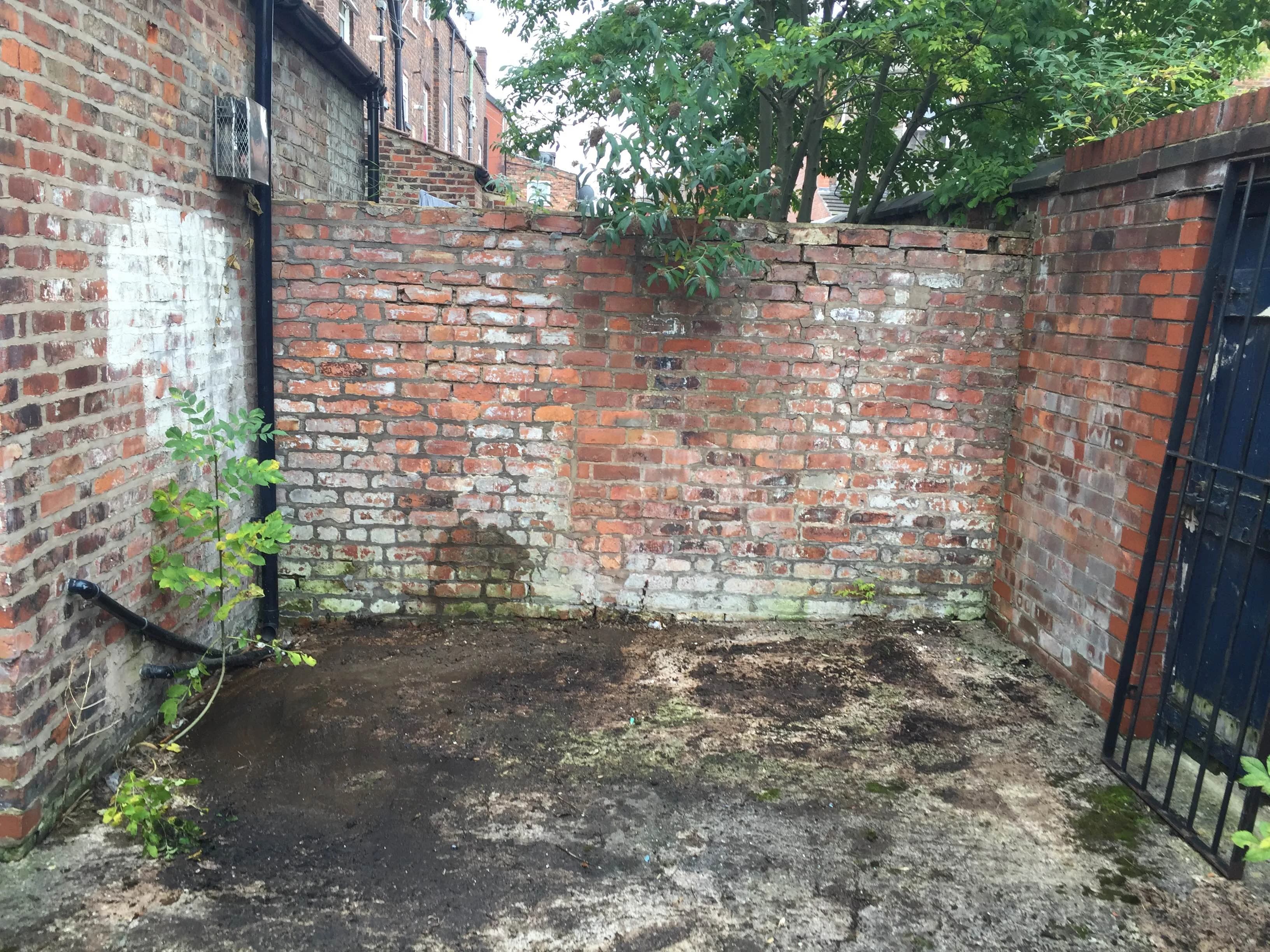 After Garden Waste Removal - completed clearance showing clean space