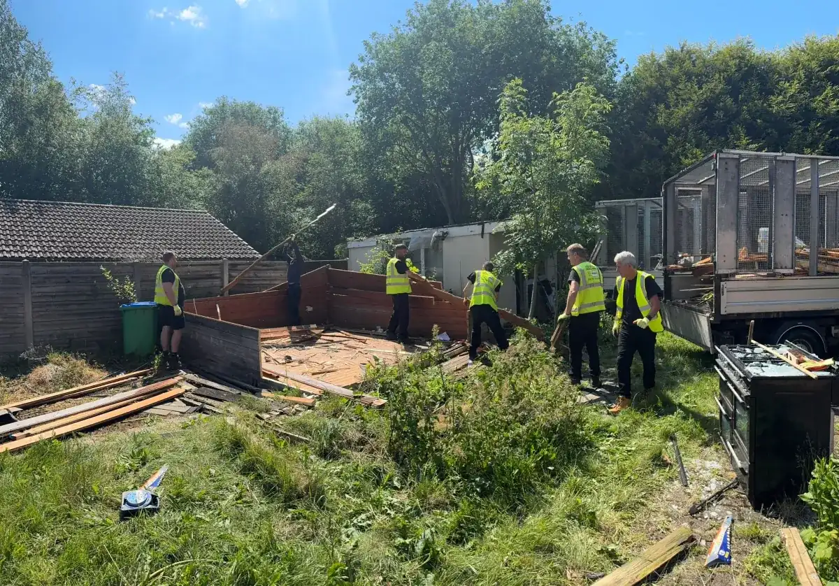 Uniformed team loading waste into van in the North West