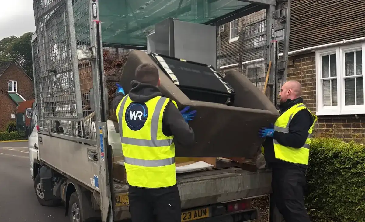 Uniformed team loading waste into van in the North West