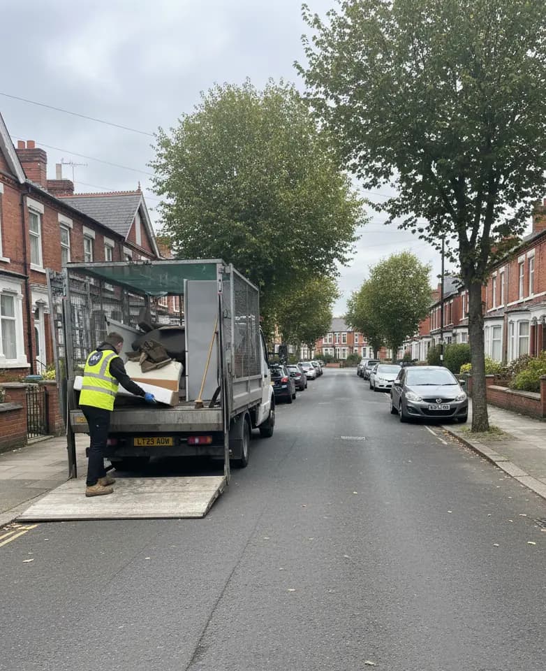 Uniformed team loading waste into van in the North West