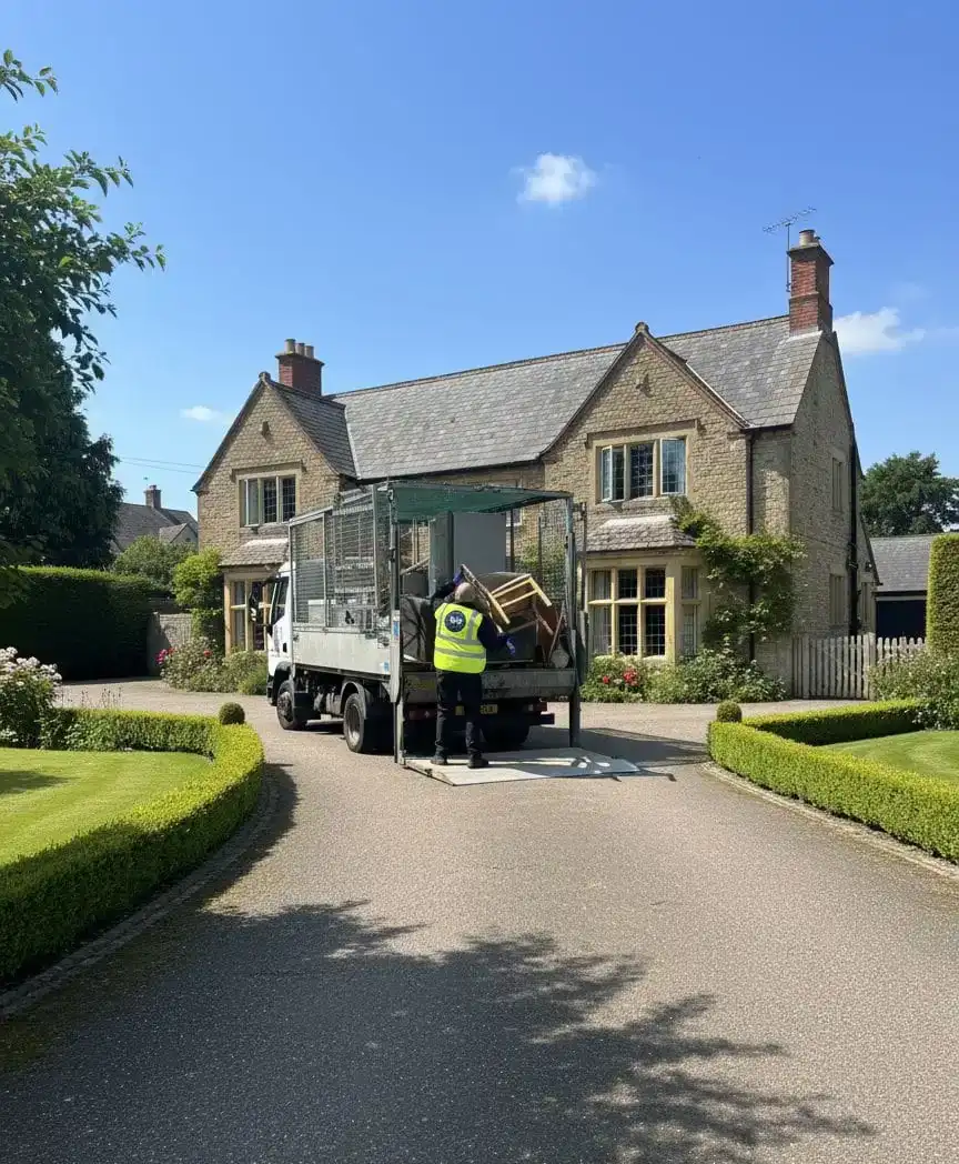 Uniformed team loading waste into van in the North West