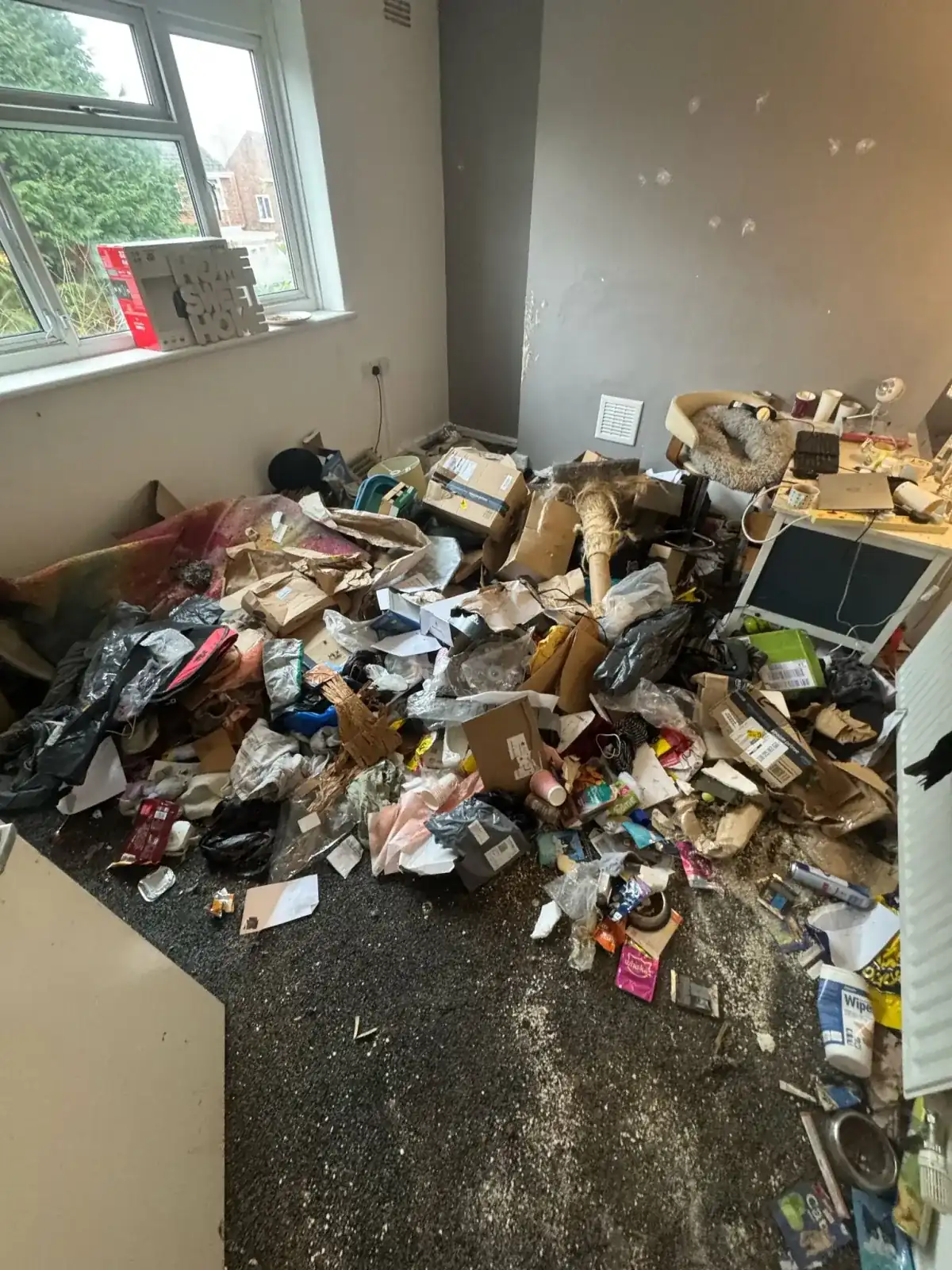 Uniformed team loading waste into van in the North West
