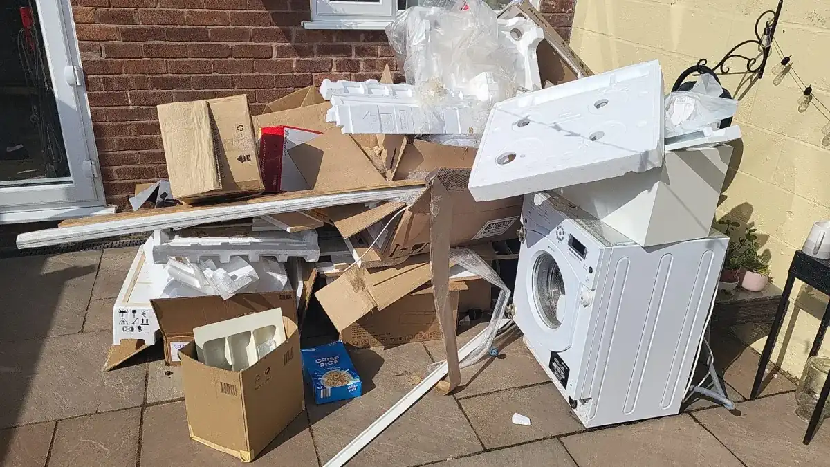 Uniformed team loading waste into van in the North West