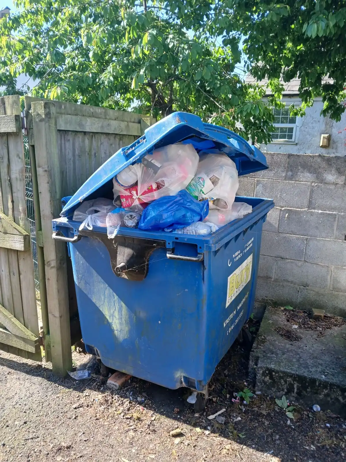 Uniformed team loading waste into van in the North West