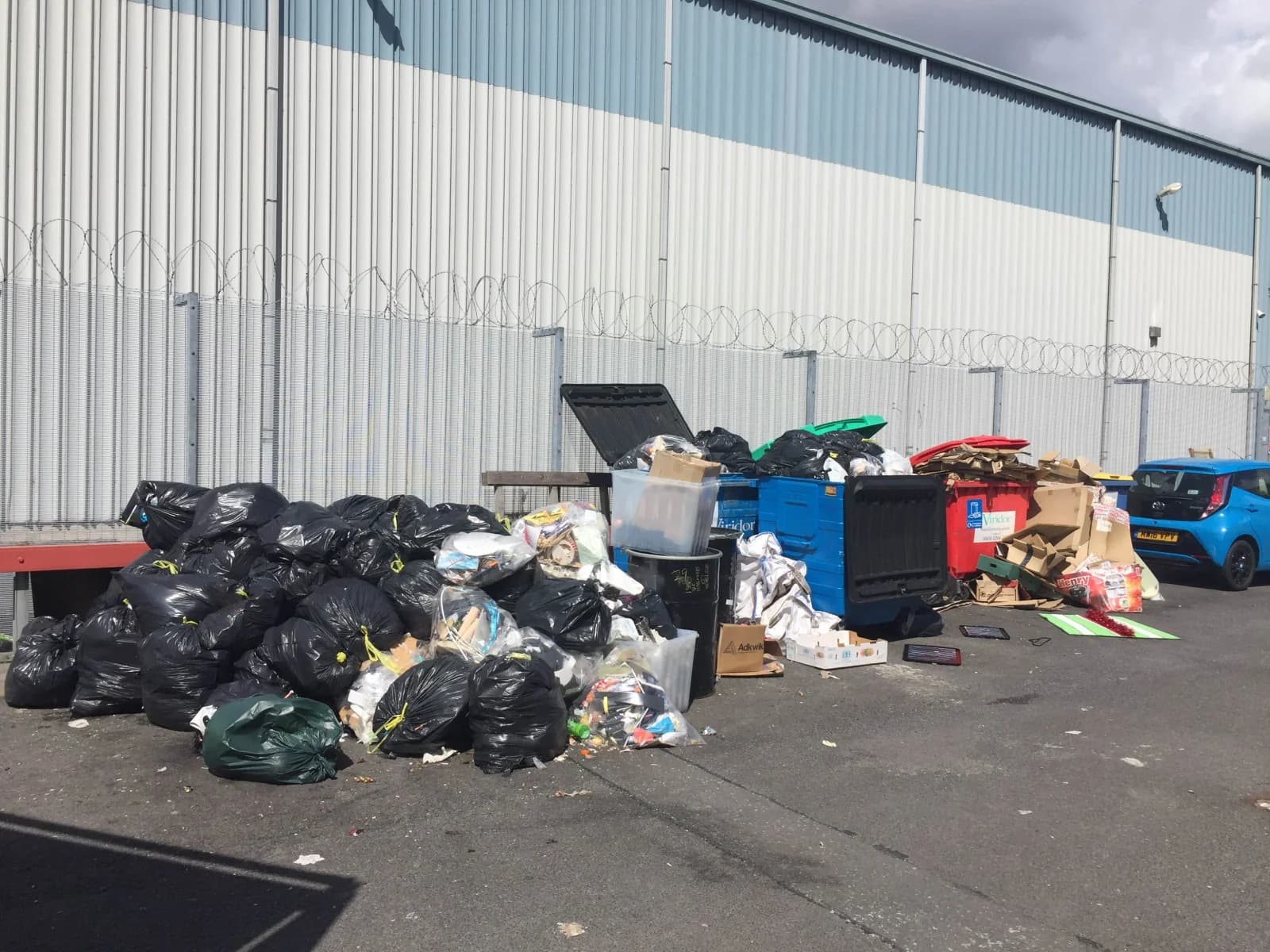Commercial premises with stacked business waste awaiting collection